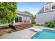 A backyard features a refreshing swimming pool and a diving board, offering outdoor enjoyment at 7132 Deer Brook St, Willow Springs, NC 27592