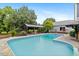 A beautiful backyard with a large swimming pool and outdoor seating area, perfect for relaxing at 7132 Deer Brook St, Willow Springs, NC 27592