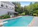 A sparkling swimming pool and well maintained home with manicured landscaping at 7132 Deer Brook St, Willow Springs, NC 27592
