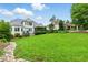 Expansive backyard featuring a well-manicured lawn and lush landscaping at 77 Ruffed Grouse, Chapel Hill, NC 27517