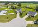 Aerial view of a well maintained two story home with fenced in backyard and mature trees at 81 Dot Ct, Fuquay Varina, NC 27526