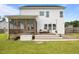Beautiful home backyard with a screened porch, a cozy deck and well-maintained green lawn at 81 Dot Ct, Fuquay Varina, NC 27526