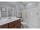 A bathroom with a single vanity and a shower with a curtain at 81 Dot Ct, Fuquay Varina, NC 27526