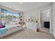 Bedroom featuring plush carpets, a large window, and soft, colorful decor at 81 Dot Ct, Fuquay Varina, NC 27526
