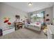 Bedroom with colorful window dressings, a low bed, and kid friendly decor at 81 Dot Ct, Fuquay Varina, NC 27526