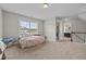 Bedroom with large window, neutral carpet and adjacent laundry room and bedroom at 81 Dot Ct, Fuquay Varina, NC 27526