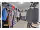 Walk-in closet with wire shelving and rods full of clothes, shoes, and boxes at 81 Dot Ct, Fuquay Varina, NC 27526
