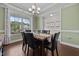 Bright dining room featuring a large window, modern lighting, and comfortable seating for Gathering gatherings at 81 Dot Ct, Fuquay Varina, NC 27526
