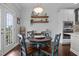 A cozy dining area with a wood table and chairs, plus open shelving at 81 Dot Ct, Fuquay Varina, NC 27526
