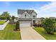 Beautiful home with a well-manicured lawn, a two-car garage, and mature trees in a desirable neighborhood at 81 Dot Ct, Fuquay Varina, NC 27526