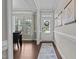 Inviting foyer with hardwood floors, a view into the dining room, and natural light at 81 Dot Ct, Fuquay Varina, NC 27526
