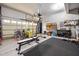 Organized garage space with workout equipment, storage, and a well-lit area for various activities at 81 Dot Ct, Fuquay Varina, NC 27526