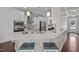 Modern kitchen with stainless steel appliances, granite countertops, and a breakfast bar with seating at 81 Dot Ct, Fuquay Varina, NC 27526