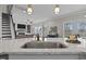 A spacious kitchen with marble counters overlooking the living area at 81 Dot Ct, Fuquay Varina, NC 27526
