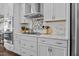 Well-equipped kitchen with stainless steel appliances, granite countertops, and ample cabinet space at 81 Dot Ct, Fuquay Varina, NC 27526