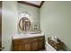 Charming half-bathroom with white countertop, oval mirror, and neutral decor at 821 Ascot Ln, Raleigh, NC 27615