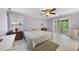 Serene bedroom featuring sliding glass doors to balcony and neutral tones at 821 Ascot Ln, Raleigh, NC 27615