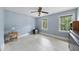 Light blue bedroom featuring two windows providing ample natural light at 821 Ascot Ln, Raleigh, NC 27615