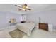 Bright and spacious bedroom featuring neutral paint, wood-look floors, and furniture at 821 Ascot Ln, Raleigh, NC 27615