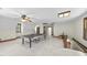 Spacious bonus room featuring a ping pong table, natural light, and neutral paint tones at 821 Ascot Ln, Raleigh, NC 27615