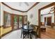 Bright breakfast nook with backyard access and adjacent seating area at 821 Ascot Ln, Raleigh, NC 27615