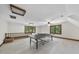 Expansive game room with ping pong table, natural light from windows, and light-colored walls at 821 Ascot Ln, Raleigh, NC 27615