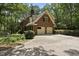 Charming brick home with a two-car garage and well-maintained landscaping at 821 Ascot Ln, Raleigh, NC 27615
