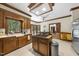 Spacious kitchen with a central island, ample counter space, and wooden cabinets at 821 Ascot Ln, Raleigh, NC 27615