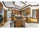 Well-equipped kitchen with central island cooktop and wooden cabinets offering plenty of storage at 821 Ascot Ln, Raleigh, NC 27615