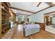 Comfortable living room with hardwood floors, exposed beams, and natural light at 821 Ascot Ln, Raleigh, NC 27615