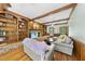 Cozy living room with built-in bookshelves, brick fireplace, and hardwood floors at 821 Ascot Ln, Raleigh, NC 27615