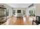 Bright living room with large windows and hardwood floors perfect for entertaining at 821 Ascot Ln, Raleigh, NC 27615