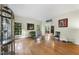 Bright living room with large windows and hardwood floors perfect for entertaining at 821 Ascot Ln, Raleigh, NC 27615