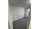 Cozy carpeted bedroom offers a serene retreat with natural light streaming through the window at 8505 Ray Rd, Raleigh, NC 27613