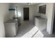 Kitchen featuring new gray cabinets, granite countertops, and new flooring at 8505 Ray Rd, Raleigh, NC 27613