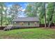 A large fenced-in backyard with lush, green grass surrounding the home at 8801 Valley Hill Ct, Apex, NC 27539