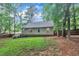 A large backyard with lush, green grass and a back deck for entertaining at 8801 Valley Hill Ct, Apex, NC 27539