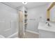 Functional bathroom includes a combined tub and shower, with floating shelves for storage at 8801 Valley Hill Ct, Apex, NC 27539