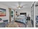 Tasteful bedroom layout features a ceiling fan, chair, artwork, and closet access on the right at 8801 Valley Hill Ct, Apex, NC 27539