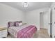 Cozy bedroom featuring a queen size bed, closet access and a view to the hallway at 8801 Valley Hill Ct, Apex, NC 27539