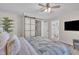 Attractive bedroom includes a ceiling fan, closet with a sliding door and connected bathroom at 8801 Valley Hill Ct, Apex, NC 27539