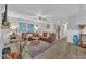 Spacious living area with hardwood floors, a fireplace, and comfortable leather seating at 8801 Valley Hill Ct, Apex, NC 27539