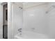 All-white bathroom with a shower and a washing machine and dryer at 105 Hanna St, Carrboro, NC 27510