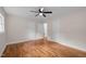 Bedroom features a ceiling fan, hardwood floors, and neutral-toned walls at 105 Hanna St, Carrboro, NC 27510