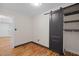 Bedroom with a wood sliding door closet and hardwood floors at 105 Hanna St, Carrboro, NC 27510