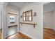 Hallway features hardwood flooring, and a rustic console table with decorative sconces at 105 Hanna St, Carrboro, NC 27510