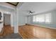 Living room with hardwood floors and neutral paint, flowing into dining and kitchen areas at 105 Hanna St, Carrboro, NC 27510