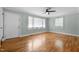 A spacious living room with hardwood floors, neutral walls, and lots of natural light at 105 Hanna St, Carrboro, NC 27510