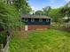 The back of this home features a walkout basement and a spacious backyard at 105 Hanna St, Carrboro, NC 27510