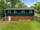 A large backyard, walk-out basement, and exterior windows are features of this home at 105 Hanna St, Carrboro, NC 27510
